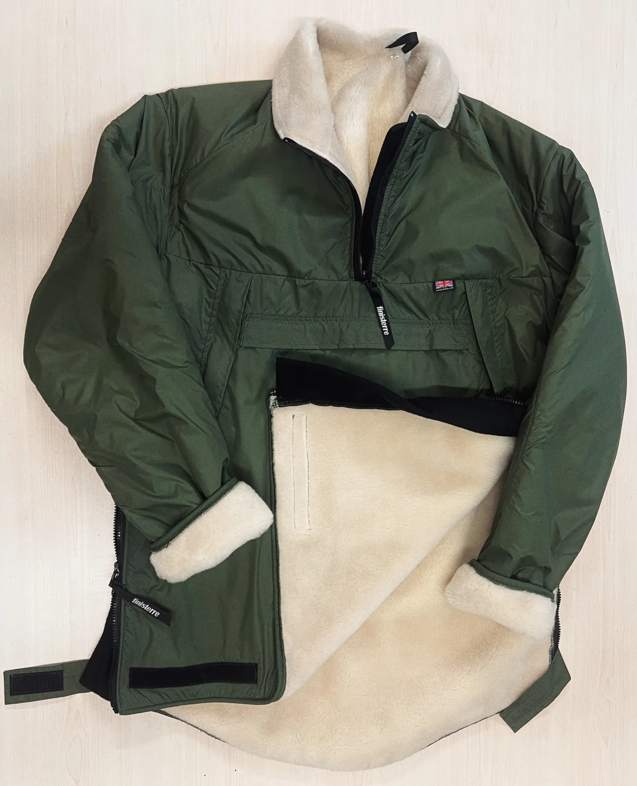 Outdoor jacket with a cream high-pile fleece lining