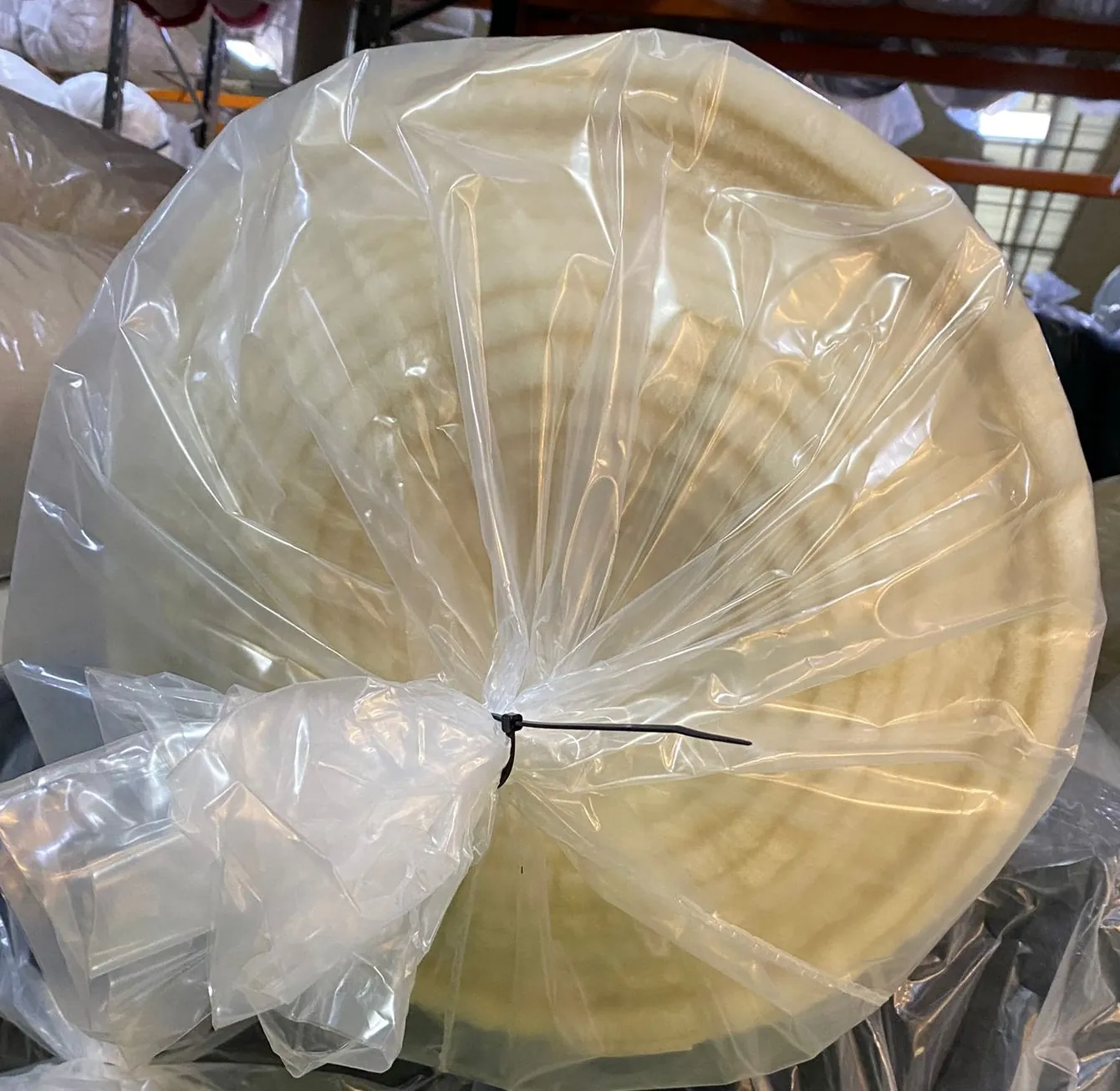 Bagged roll of wool pile fabric