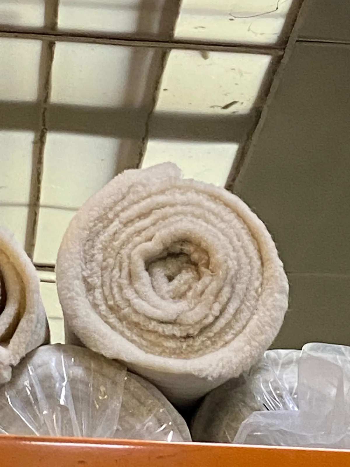Rolled undyed wool pile fabric